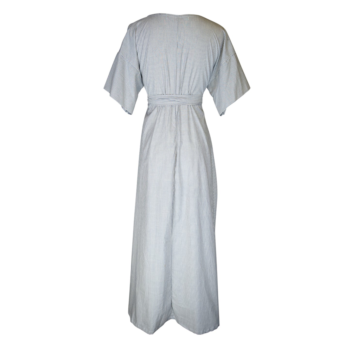 White and blue vertical pinstripe a-line midi-maxi dress featuring v-neck, short sleeves, and built-in sash ties for a cinched, wrap waist look. This dress falls at approximately lower calf or ankle. Nautical bohemian in style.