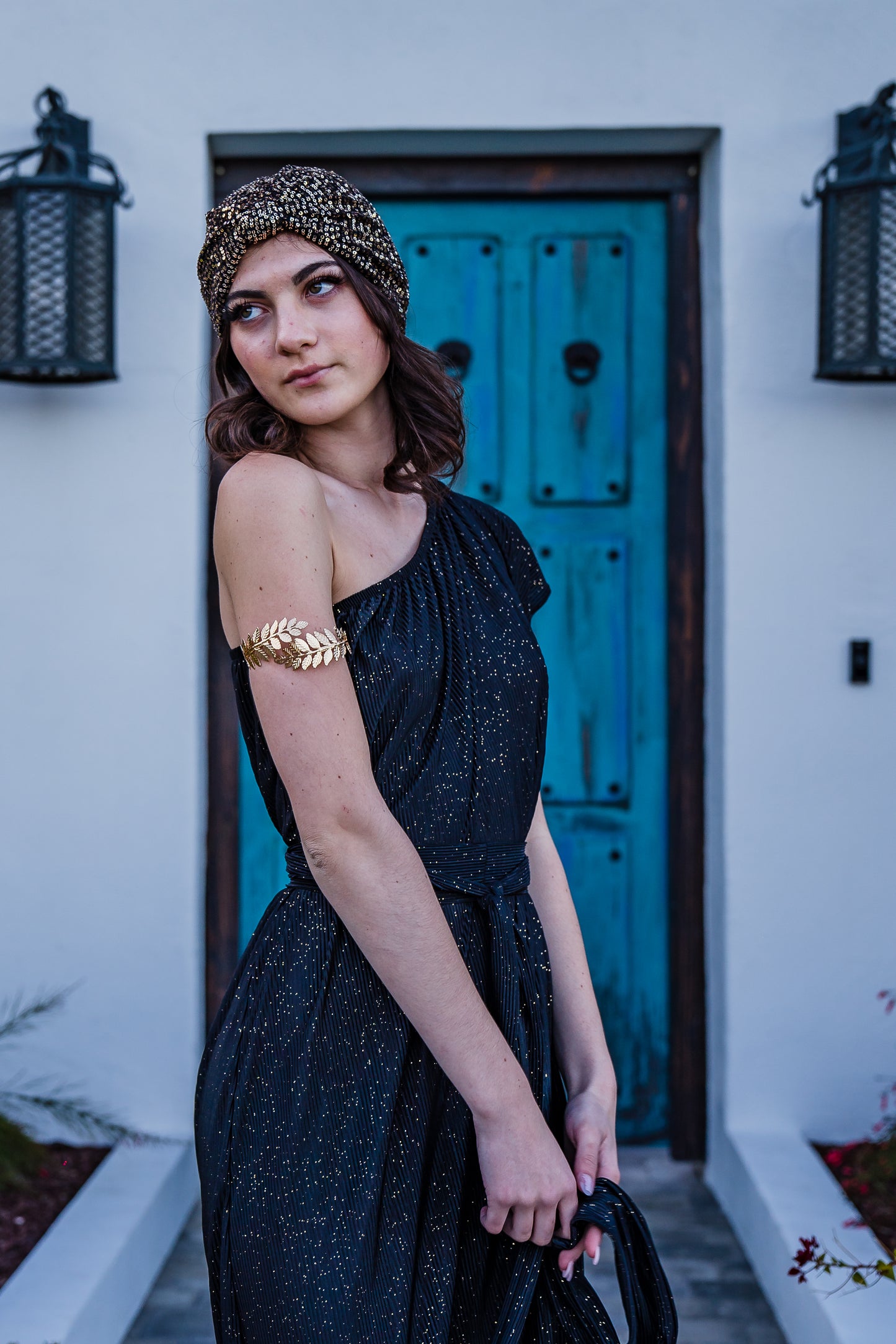 This one shoulder maxi dress was made with luxurious pleated glittery fabric.