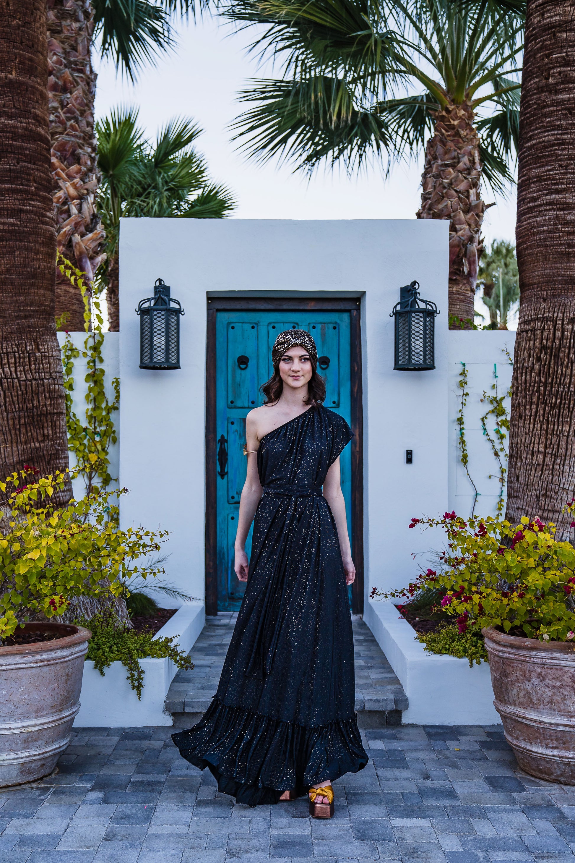 This one shoulder maxi dress was made with luxurious pleated glittery fabric.