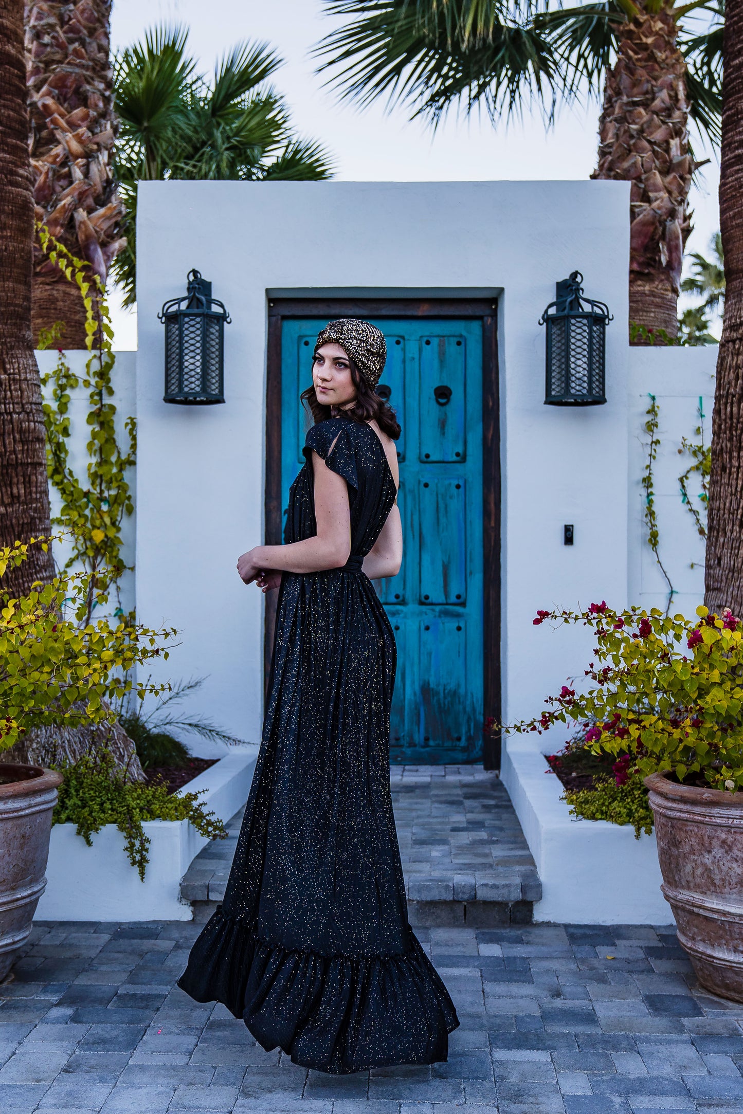 This one shoulder maxi dress was made with luxurious pleated glittery fabric.