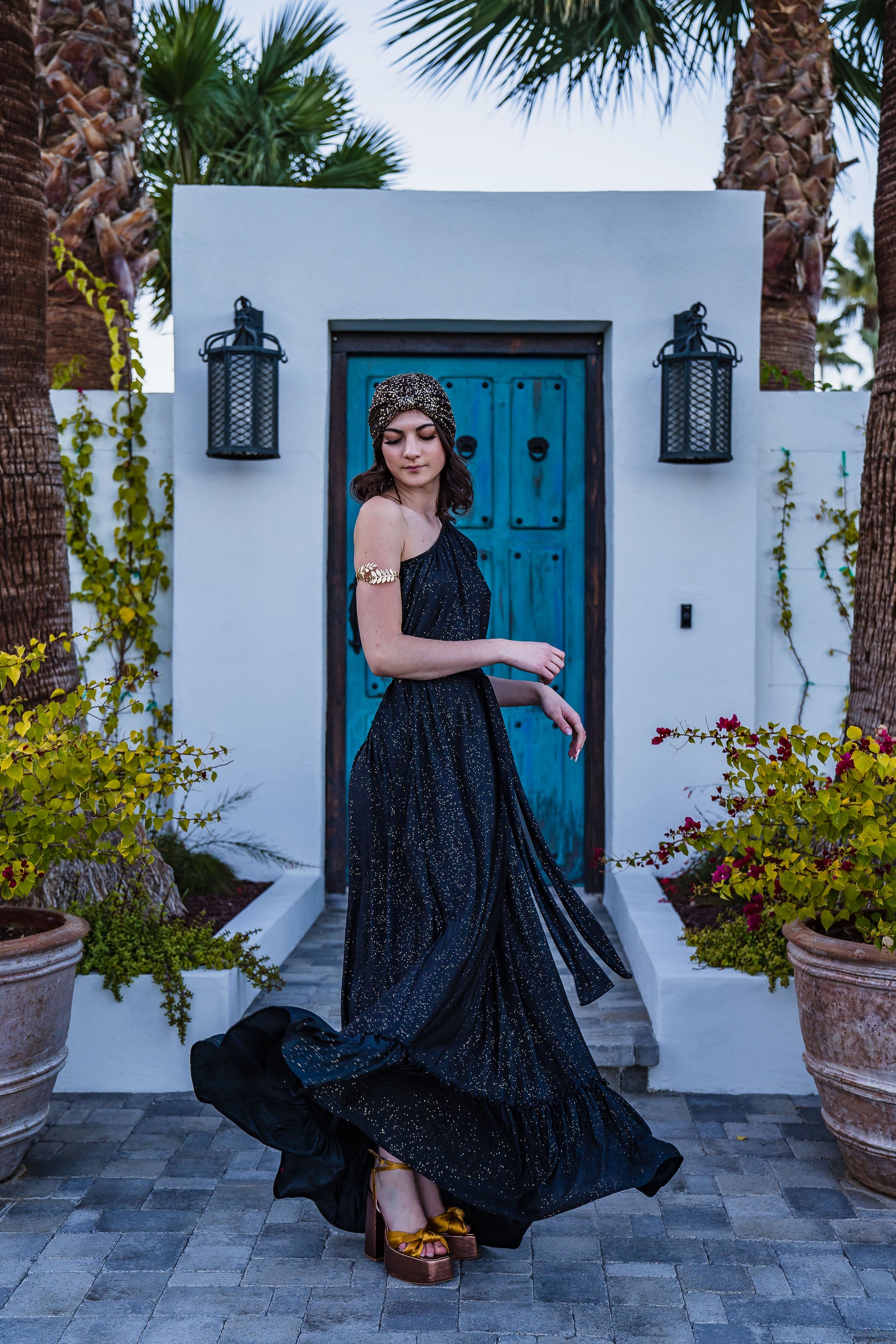 This one shoulder maxi dress was made with luxurious pleated glittery fabric.