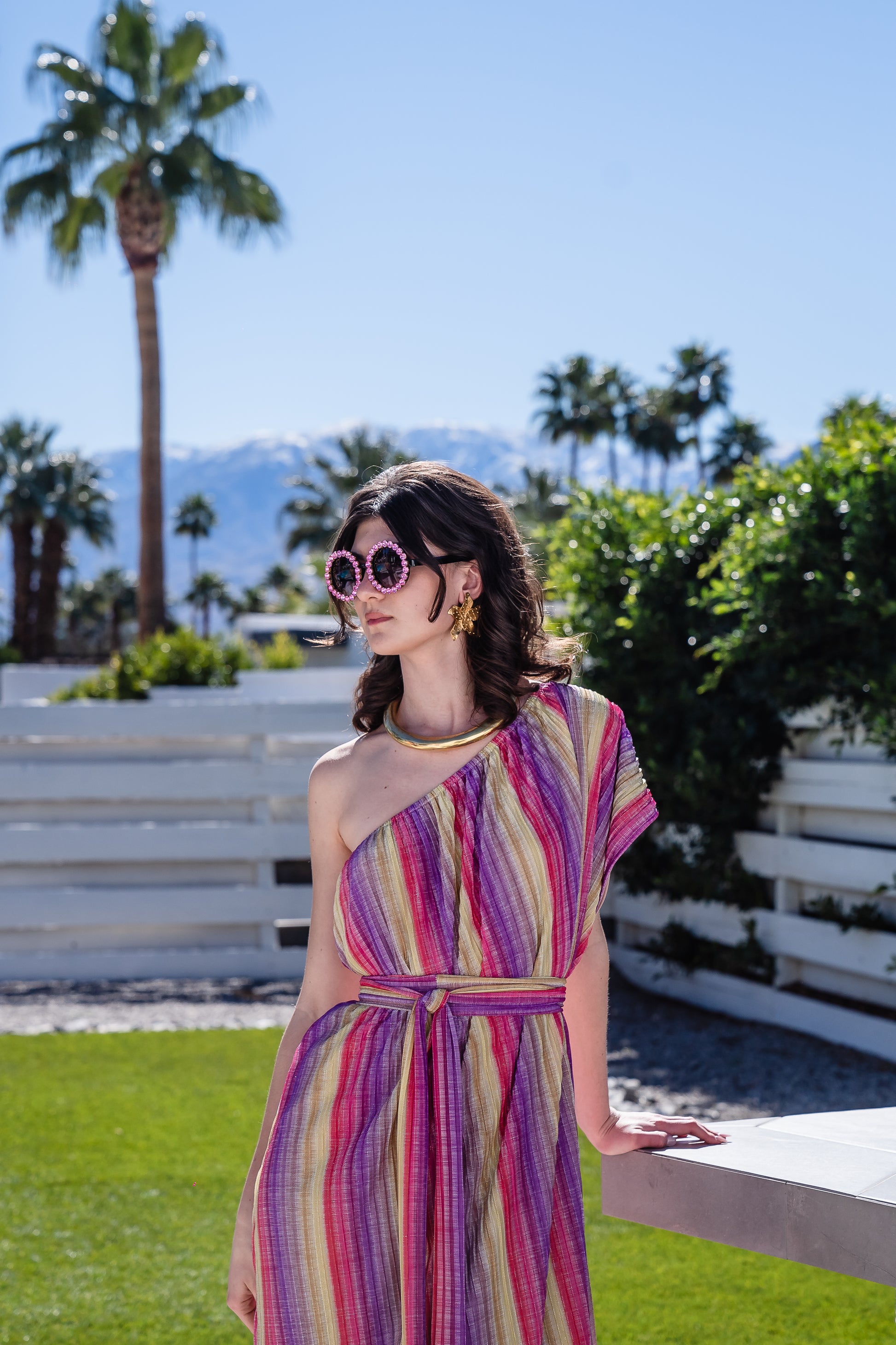 This Rainbow Prism Pleated Party One Shoulder Maxi Dress showcases a unique rainbow prism design that will have you shining at any party or event.