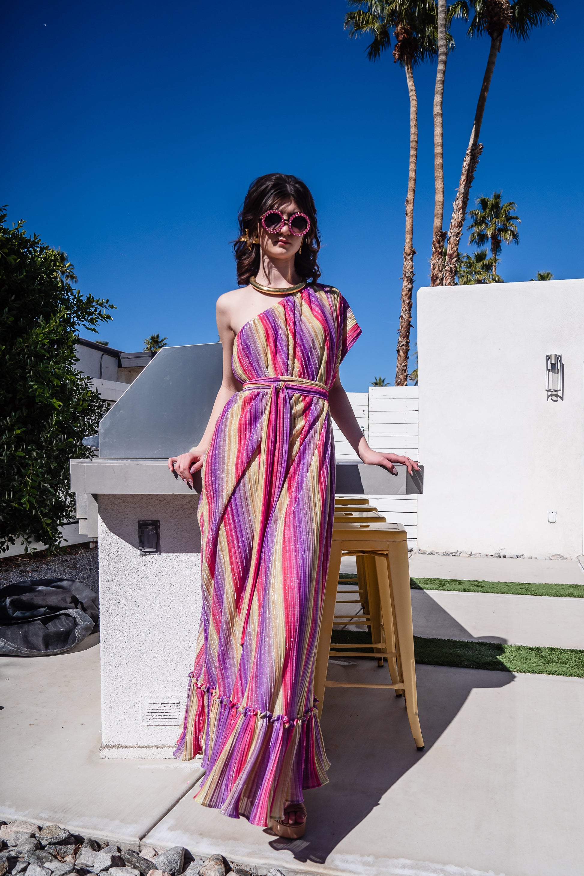 This Rainbow Prism Pleated Party One Shoulder Maxi Dress showcases a unique rainbow prism design that will have you shining at any party or event.