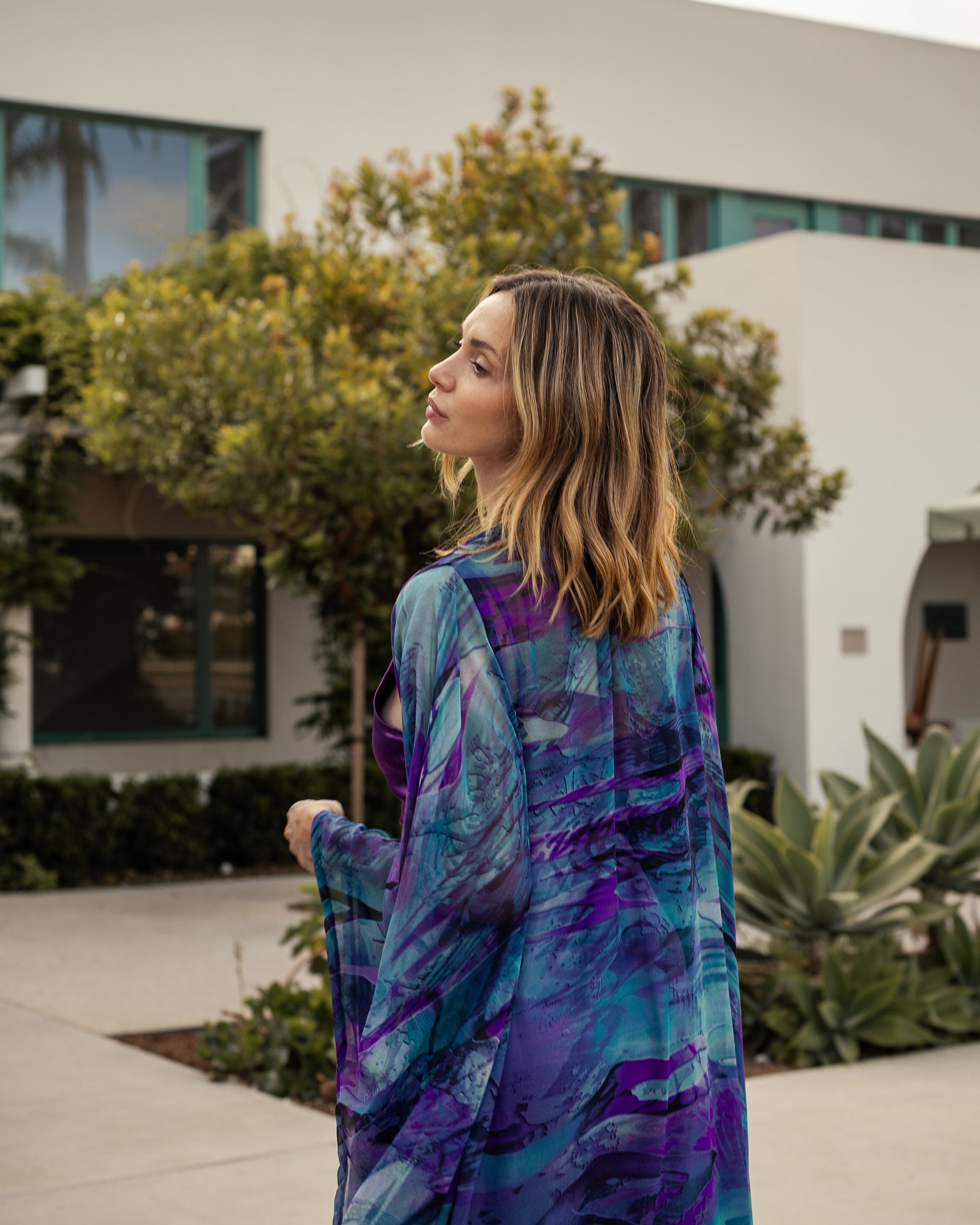 Vibrant purple teal abstract kimono robe with belt. Made from silk chiffon, this kimono exudes sultry elegance. It can be worn open as a robe or wrap dress. Long flowy sleeves with ankle hem.