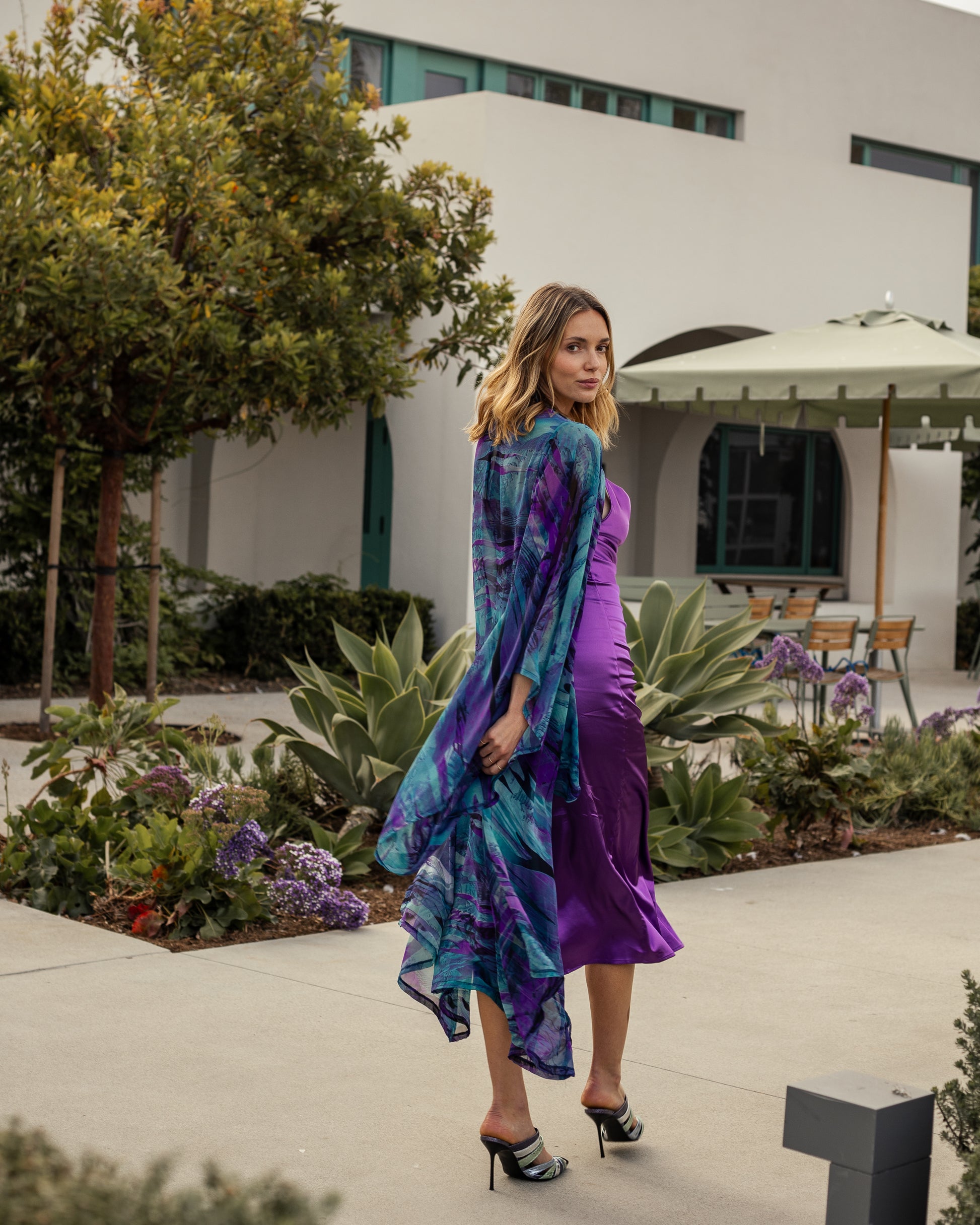 Vibrant purple teal abstract kimono robe with belt. Made from silk chiffon, this kimono exudes sultry elegance. It can be worn open as a robe or wrap dress. Long flowy sleeves with ankle hem.