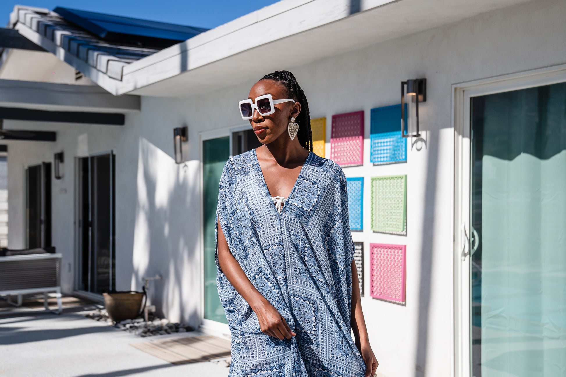 Blue patchwork caftan featuring v-neck, batwing sleeves, and ankle length hem. Airy and flowy, this bohemian inspired caftan dress is great for loungewear, layering, and beachwear. 