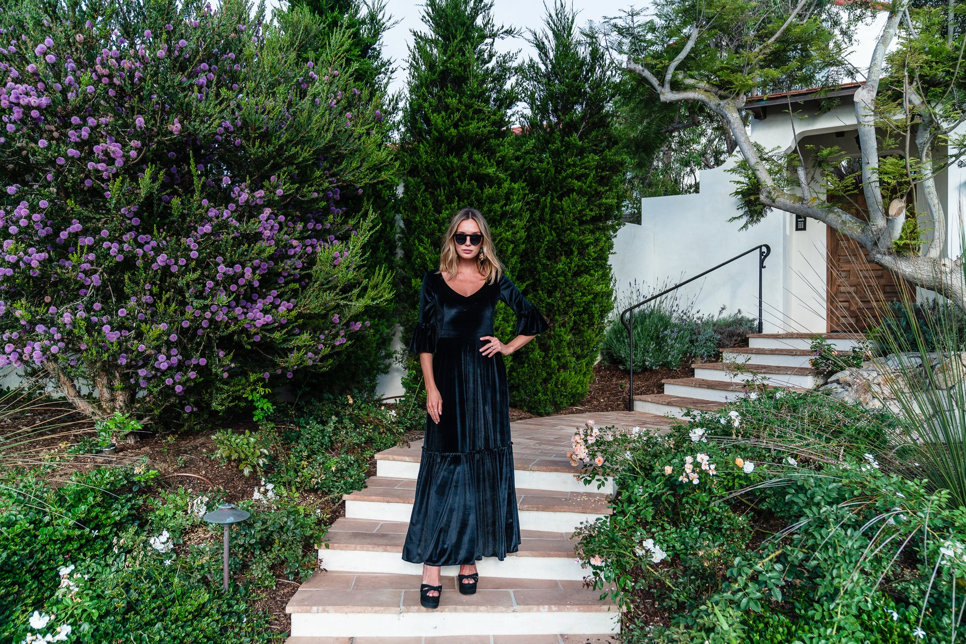 Shimmery black maxi dress with ruffle skirt and ruffled half sleeves. Featuring v-neck frontn and heart-shaped cutout in back, this dark dress is a gothic dream.