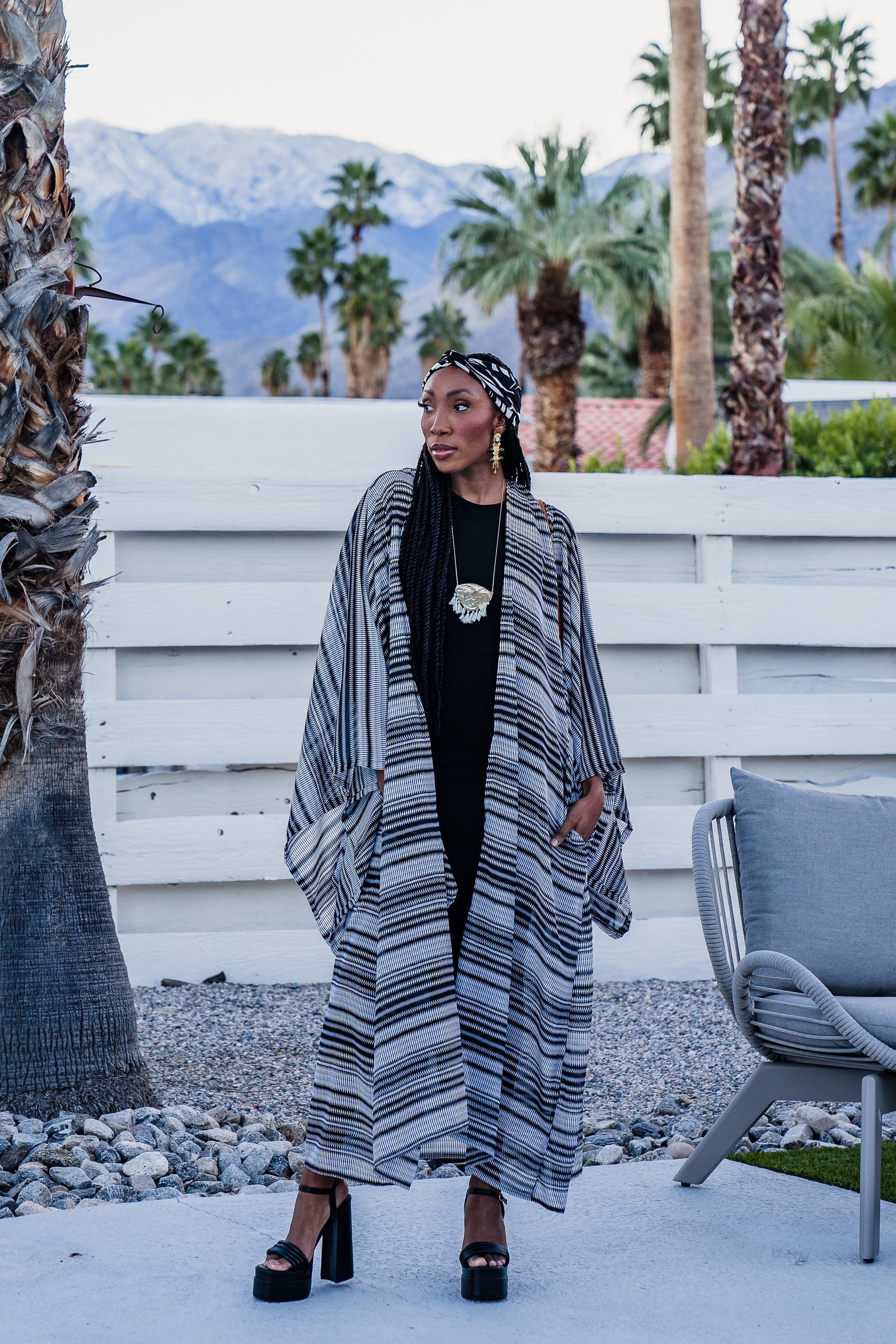 This iconic kimono was handmade in San Diego, CA with a black and white zigzag stripe patterned chiffon. Featuring pockets and a matching waist tie