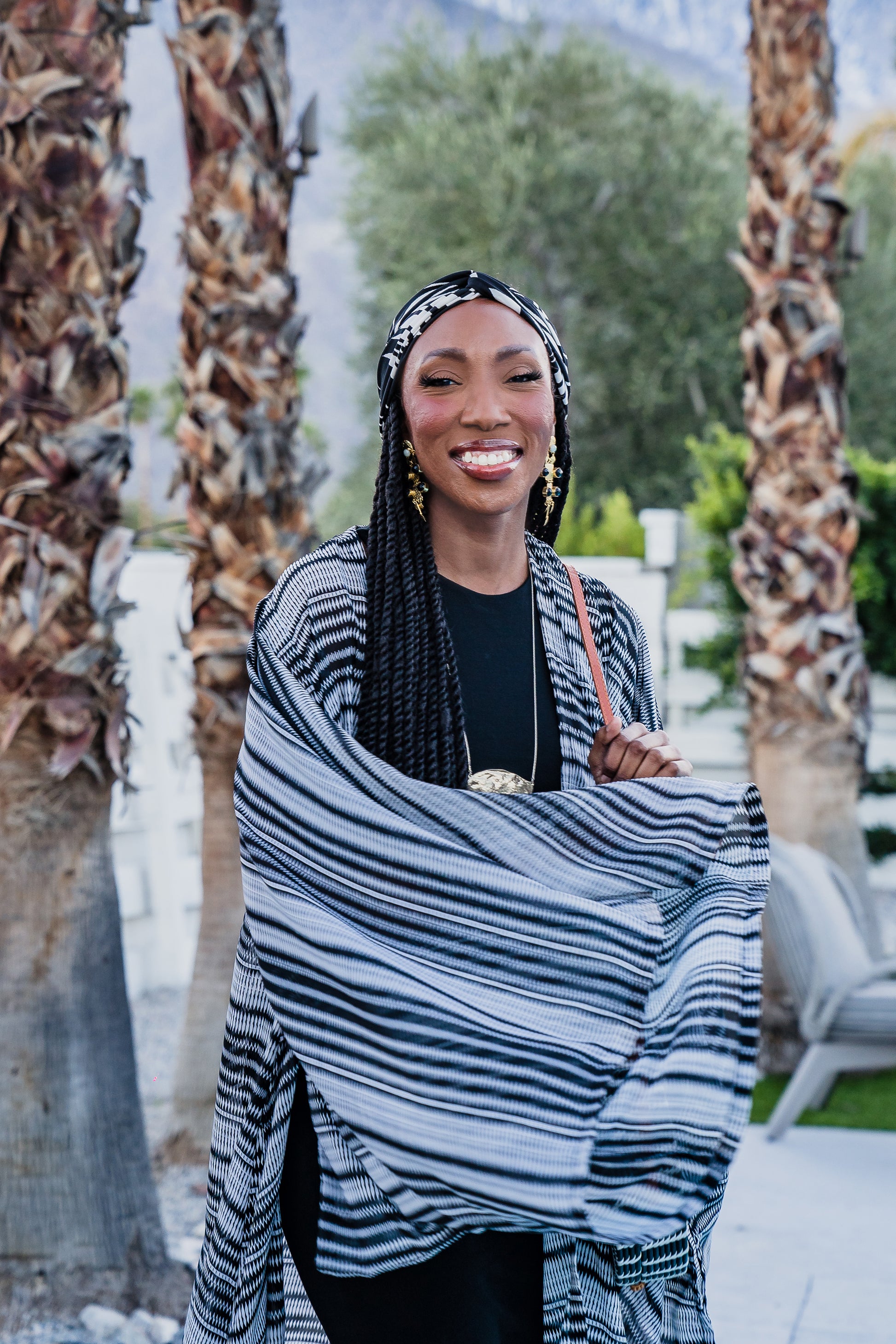 This iconic kimono was handmade in San Diego, CA with a black and white zigzag stripe patterned chiffon. Featuring pockets and a matching waist tie