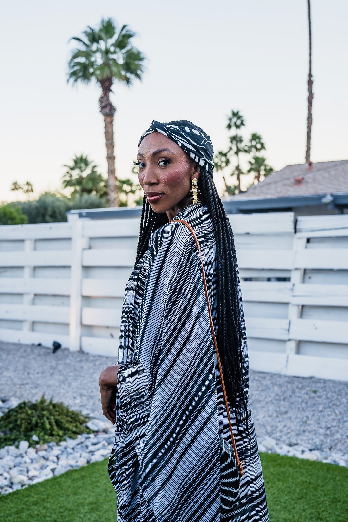 This iconic kimono was handmade in San Diego, CA with a black and white zigzag stripe patterned chiffon. Featuring pockets and a matching waist tie