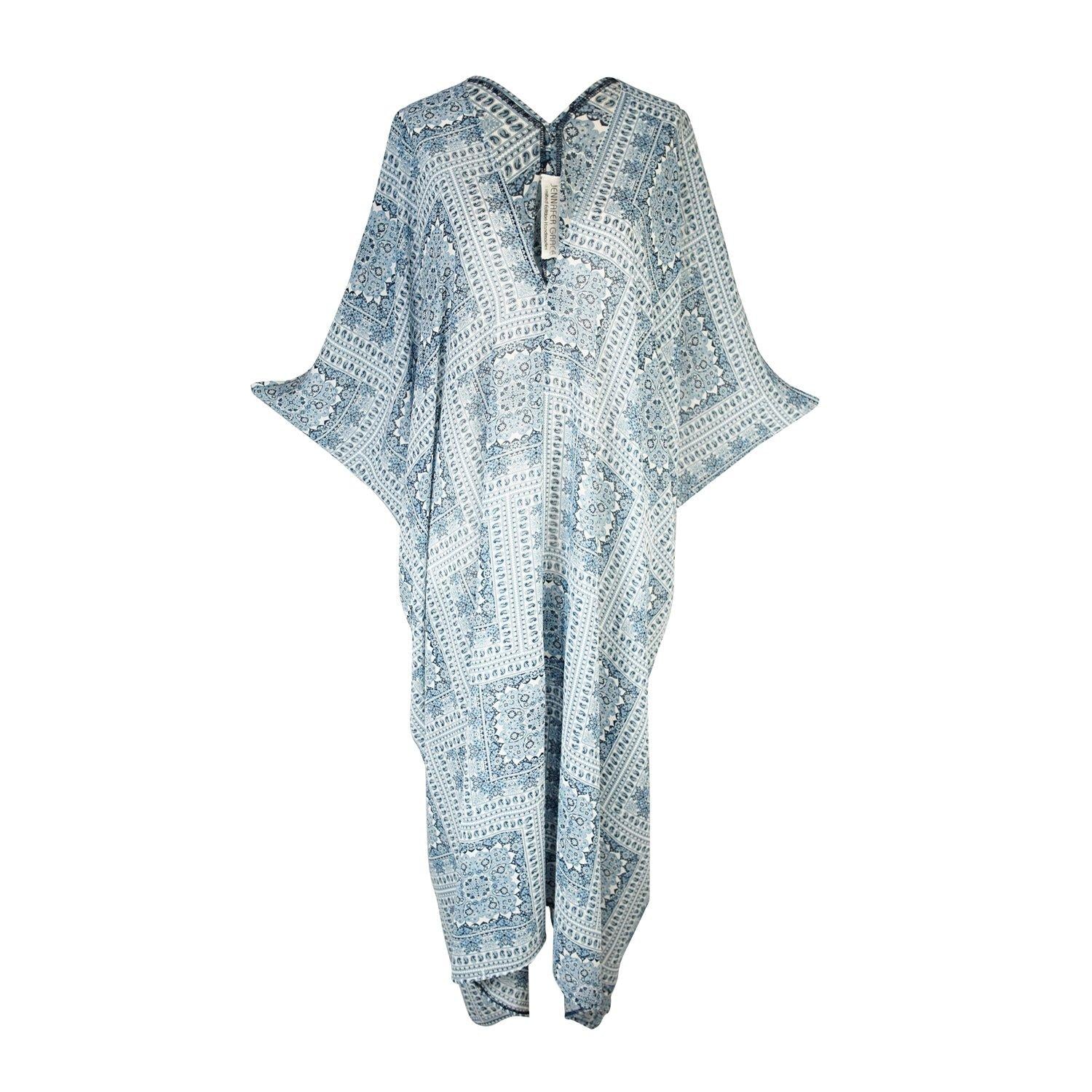 Blue patchwork caftan featuring v-neck, batwing sleeves, and ankle length hem. Airy and flowy, this bohemian inspired caftan dress is great for loungewear, layering, and beachwear. 